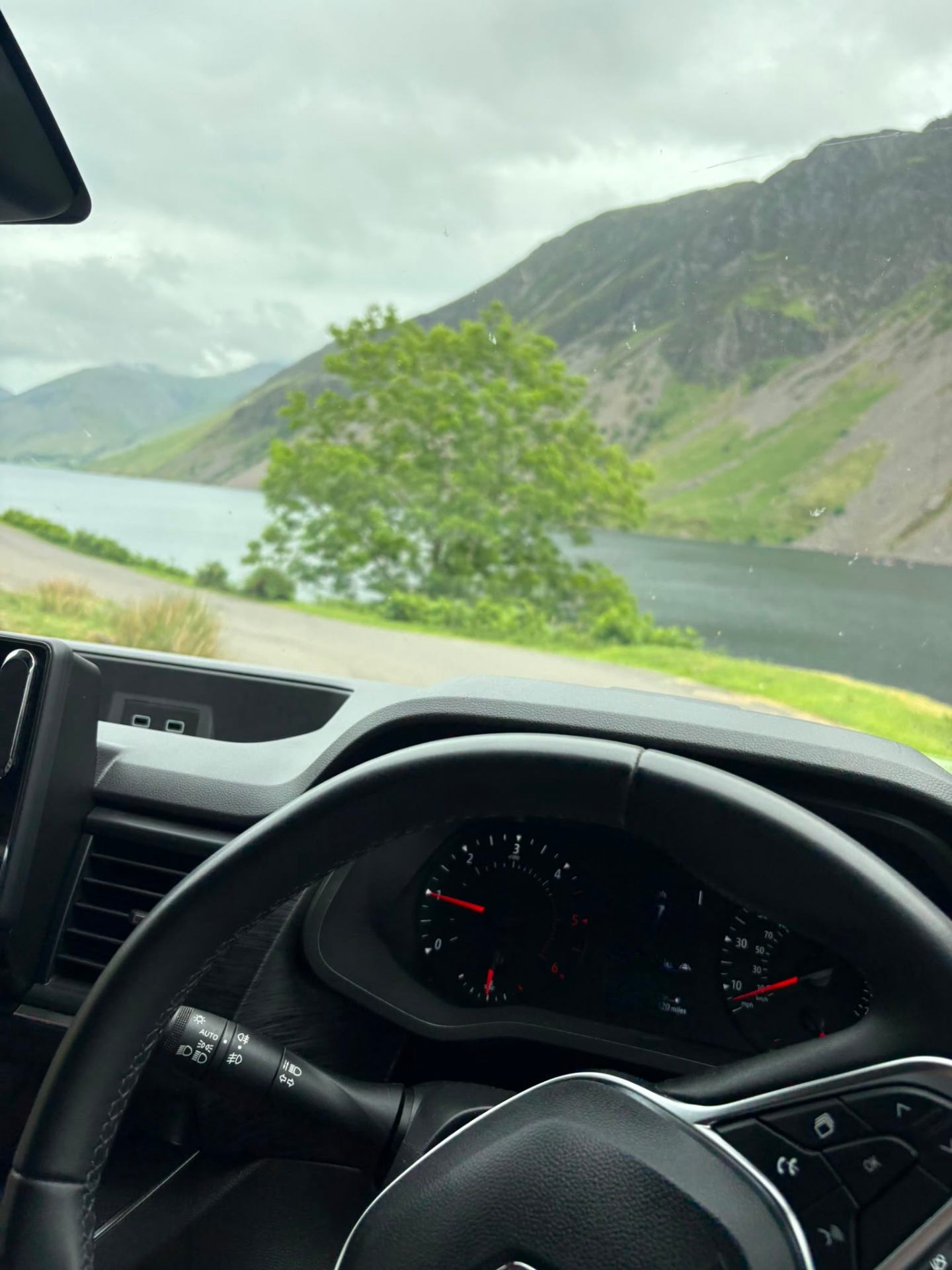 View of a lake and mountains from inside the campervan in the Lake District